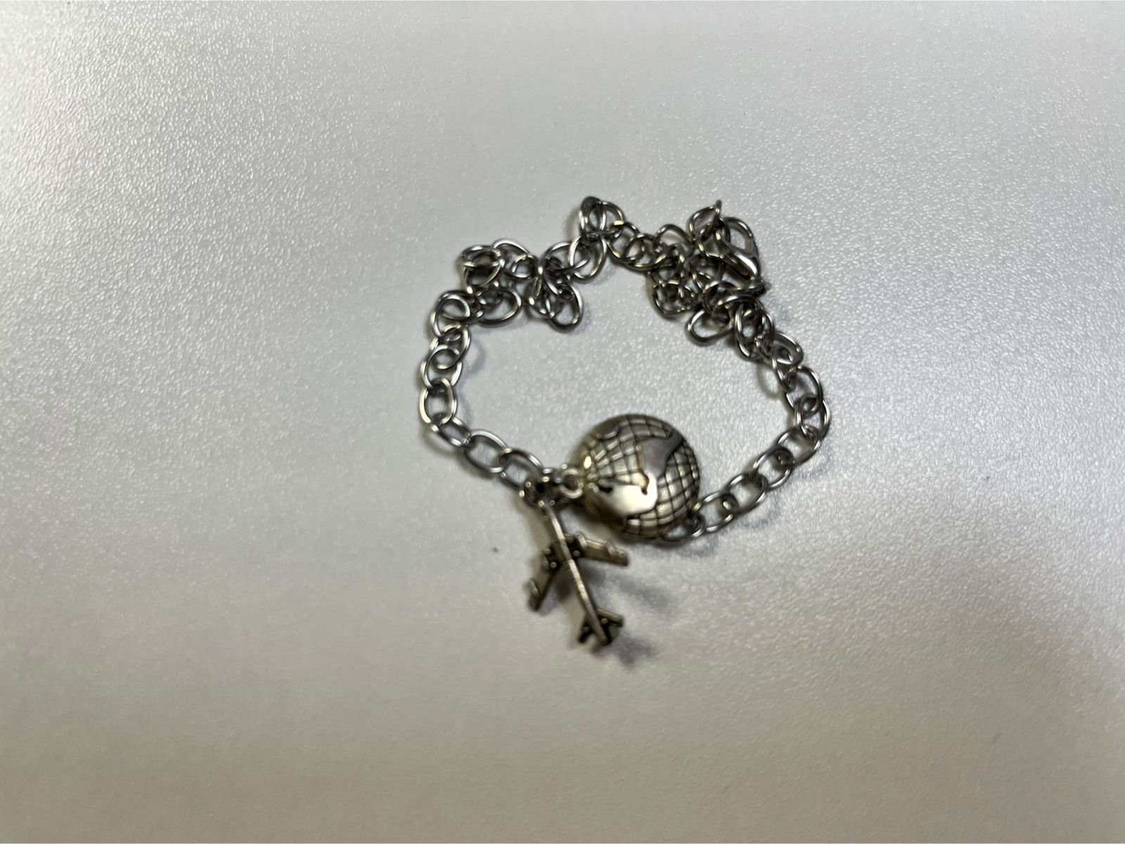 Pulsera avion y mundo acero inox