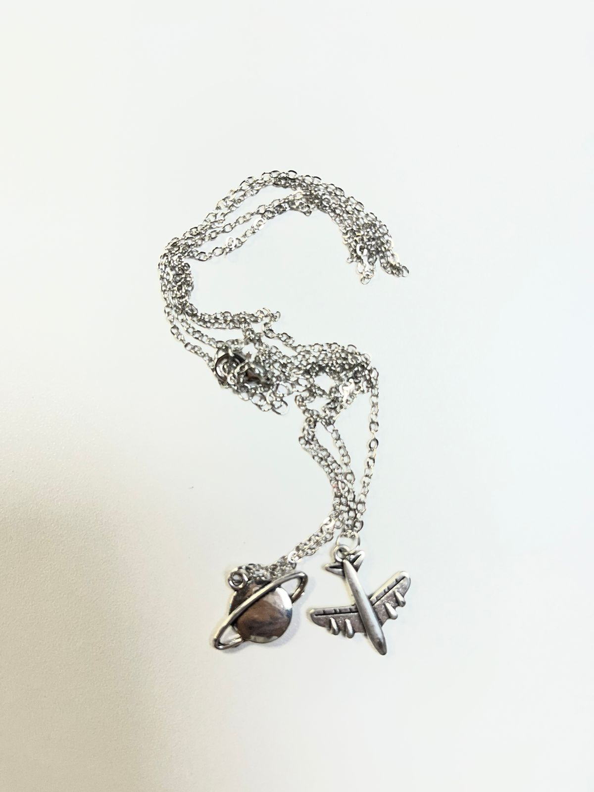 Cadena acero inox mundo y avion